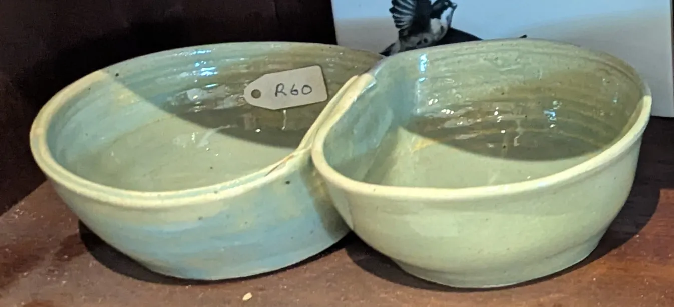 A pale green glazed double bowl