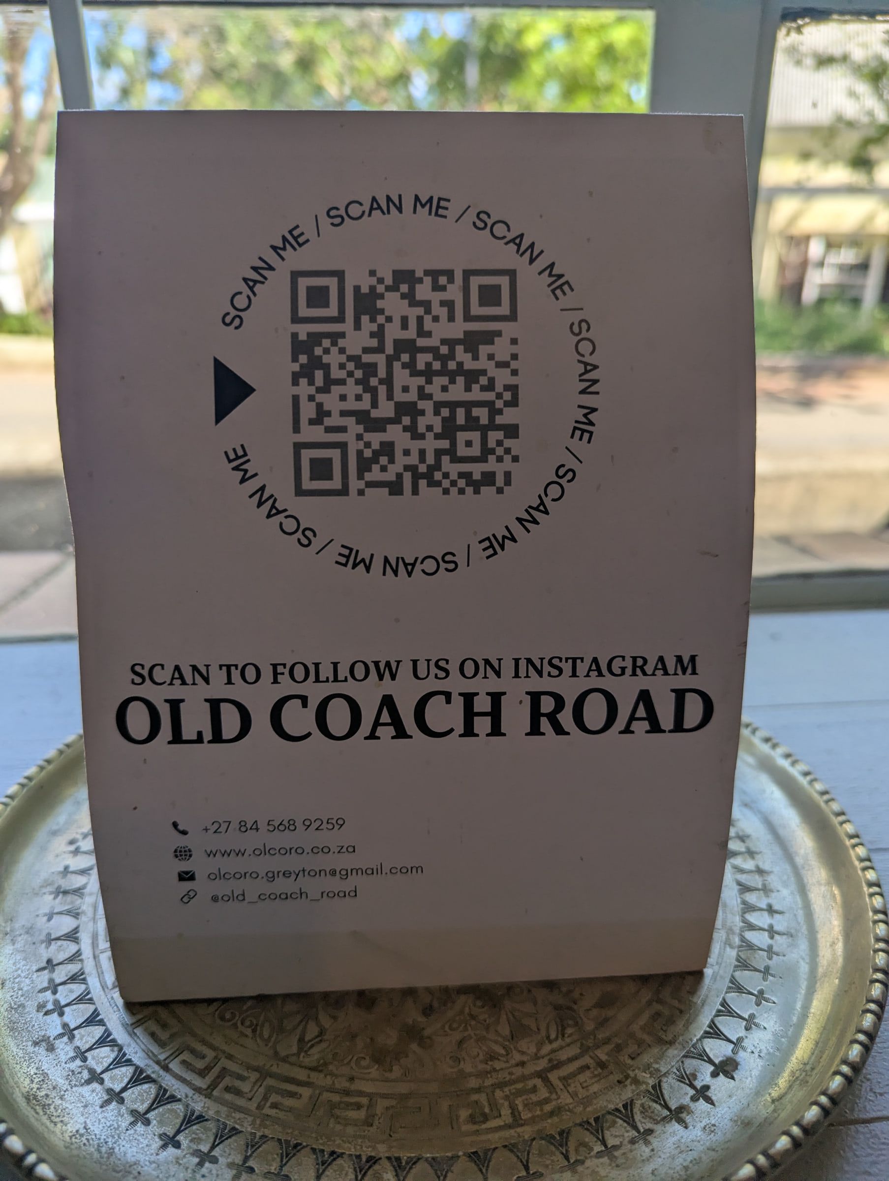 Our table sign with a QR code for Instagram